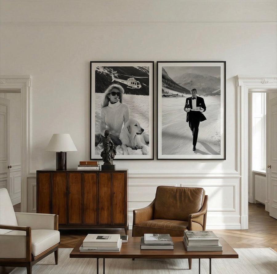 Living room with a wooden cabinet, leather chair, and framed black and white photos on the wall.