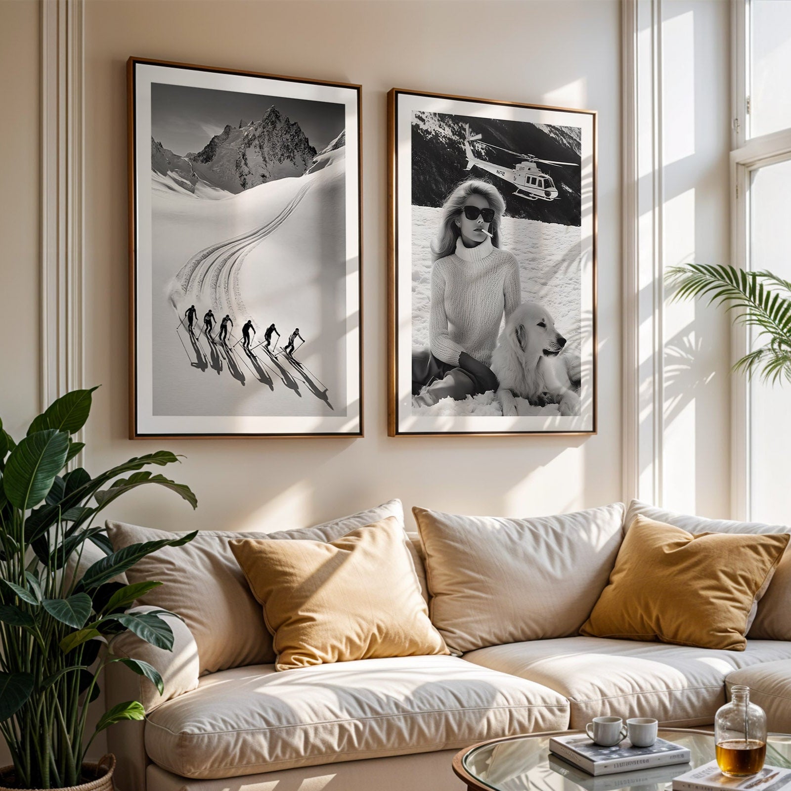 Living room with a beige sofa, decorative pillows, and framed black and white artworks on the wall.