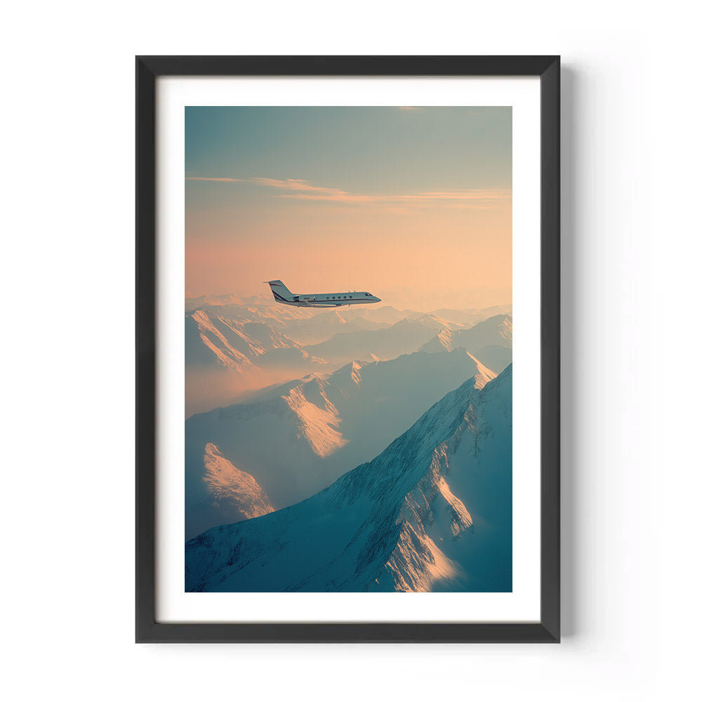 Framed artwork of an airplane flying over mountains with a sunset or sunrise sky.