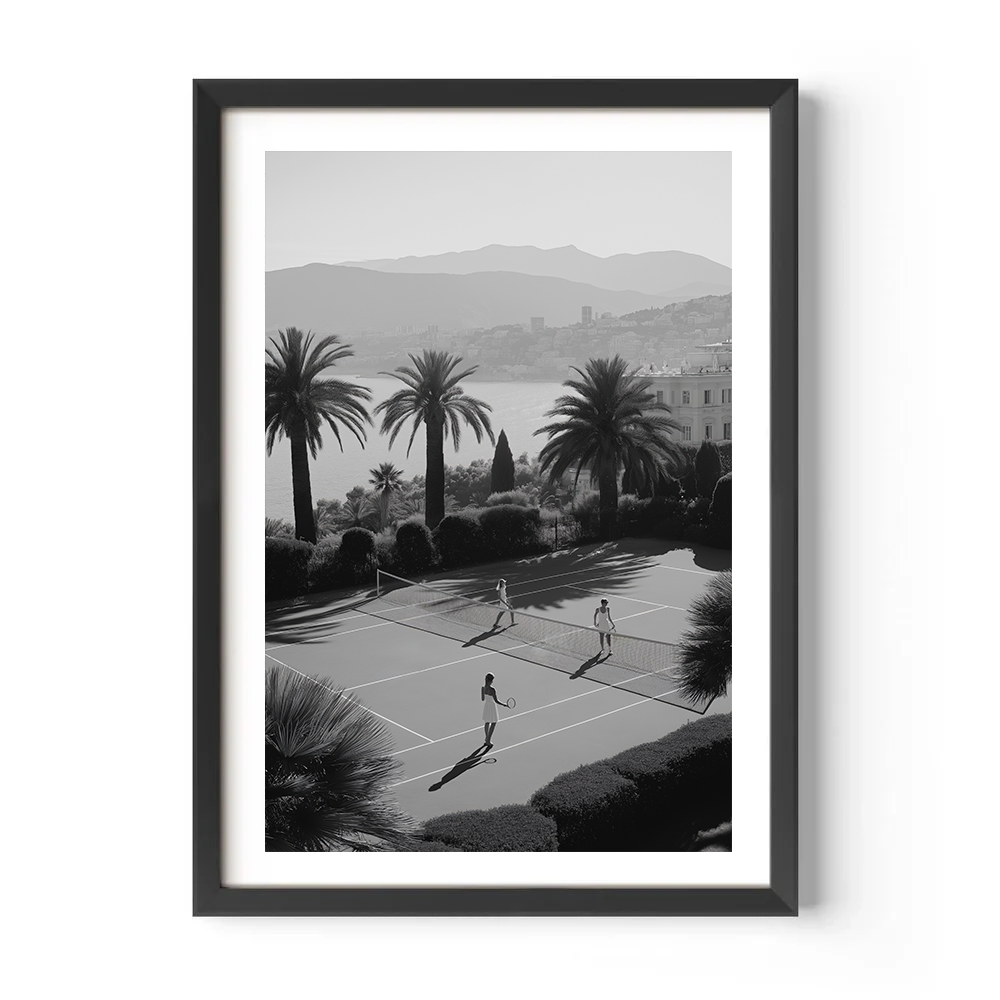 Framed black and white print of a tennis court with palm trees and mountains in the background.