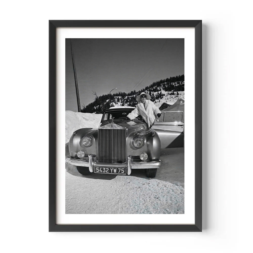 Framed black and white photograph of a vintage Rolls-Royce in a snowy landscape.
