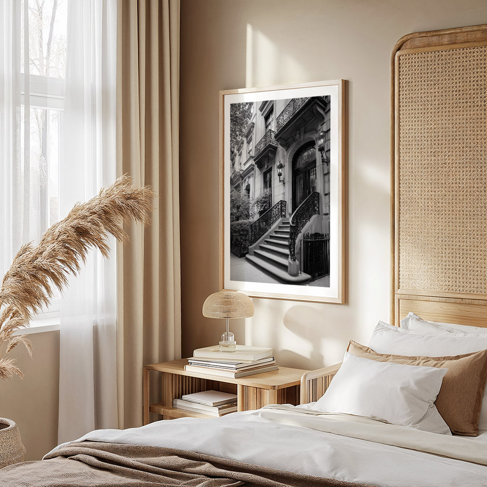 Neatly made bed with white bedding and brown pillows in a bedroom setting.