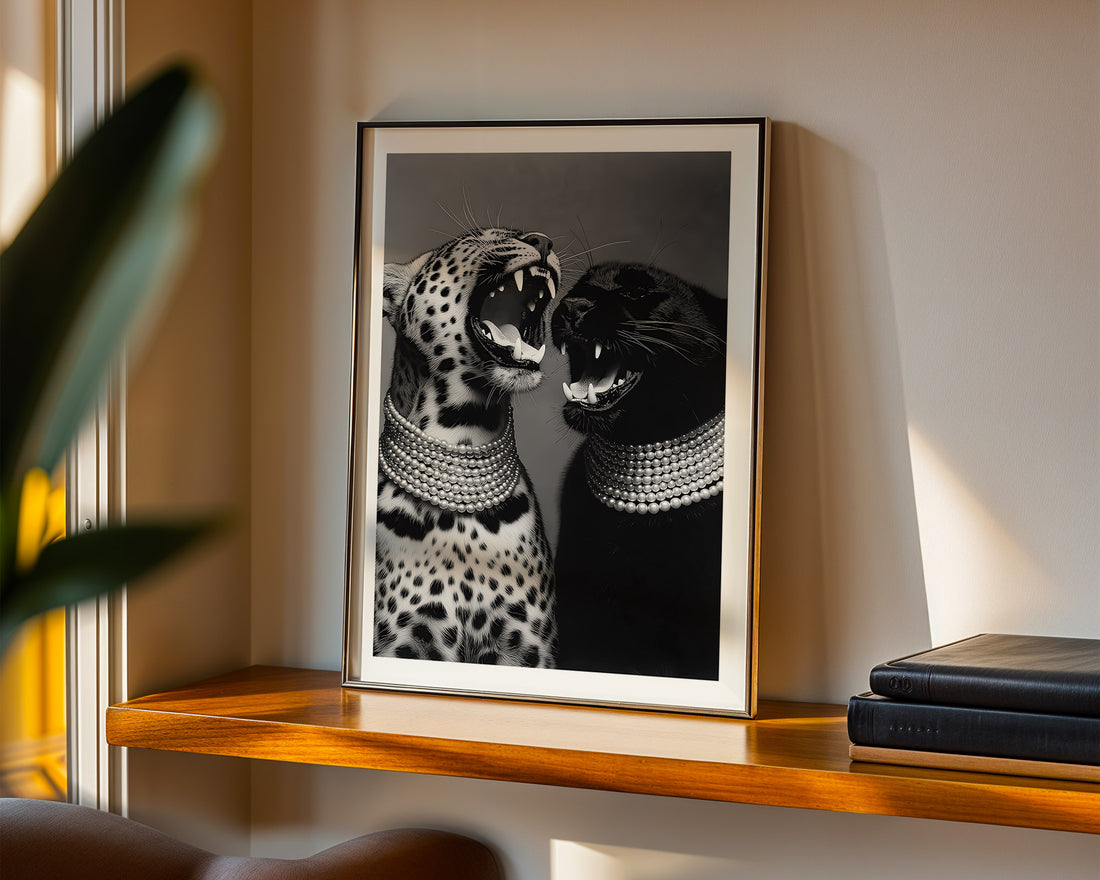 Framed artwork of two leopards on a wooden shelf with books and a plant.