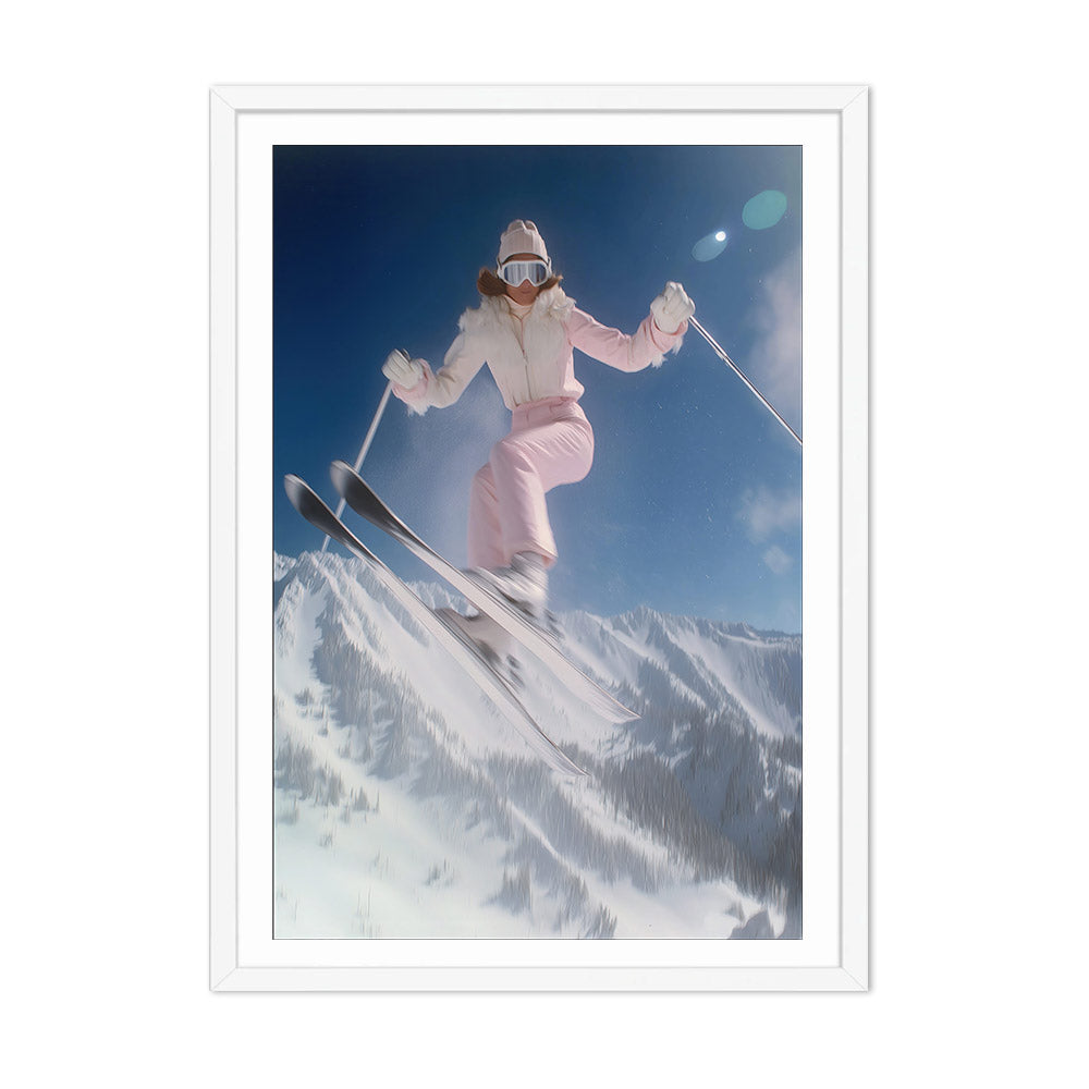 Person skiing in a snowy mountain landscape with a clear blue sky.