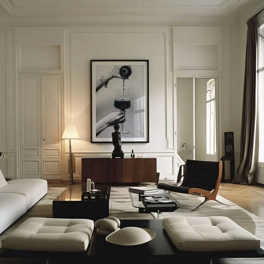 Modern living room with white sofa, black chairs, and a large window.