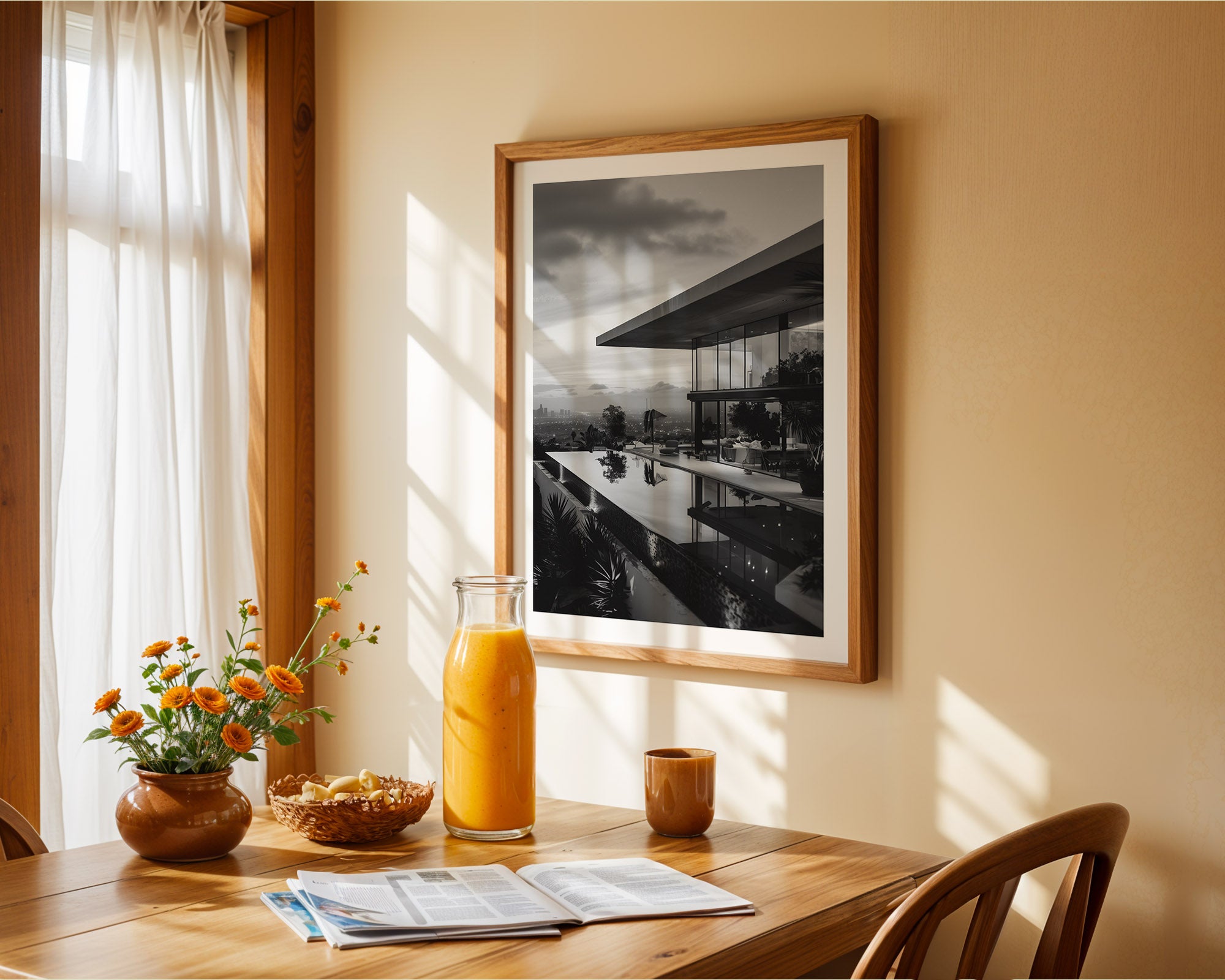 Dining room with a table set for breakfast, including a bowl of cereal, a glass of orange juice, and a vase with flowers. A framed picture hangs on the wall.