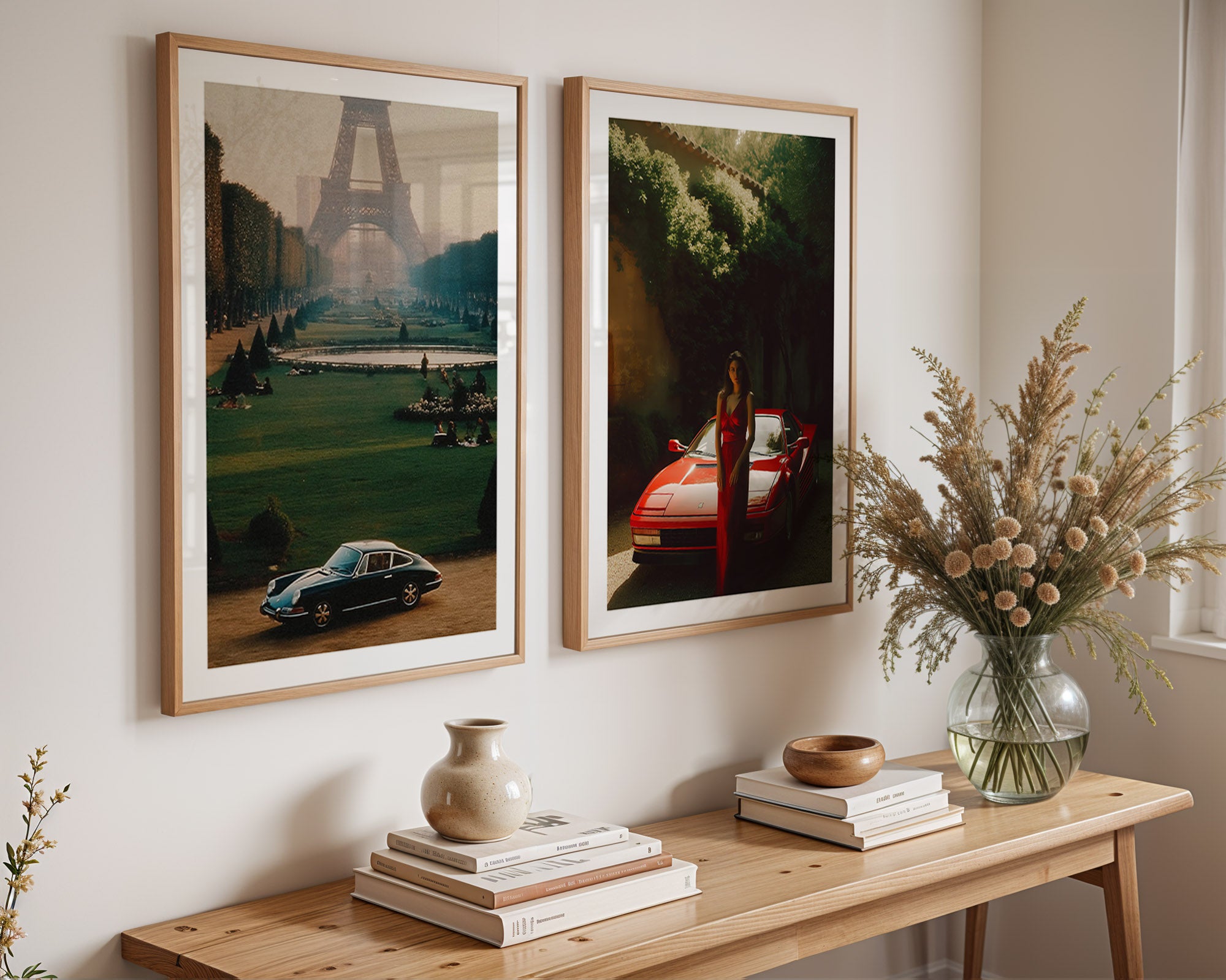 Two framed artworks on a wall above a wooden console table with decorative items.