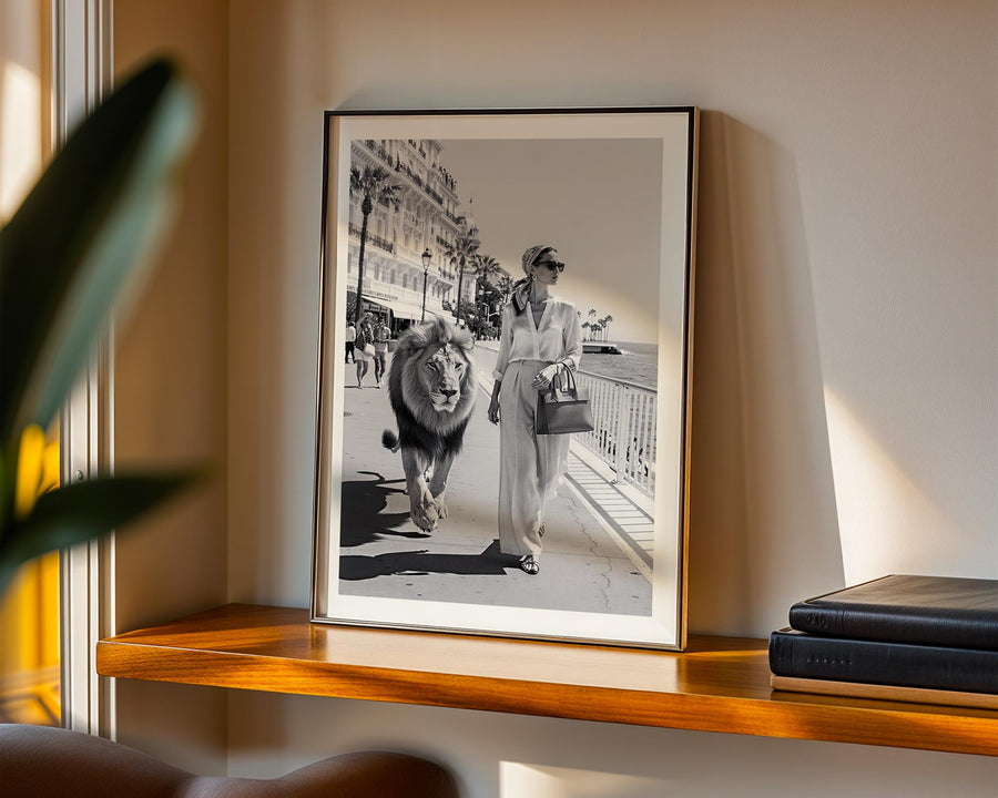 Woman walking in Cannes with a ion on the side.
