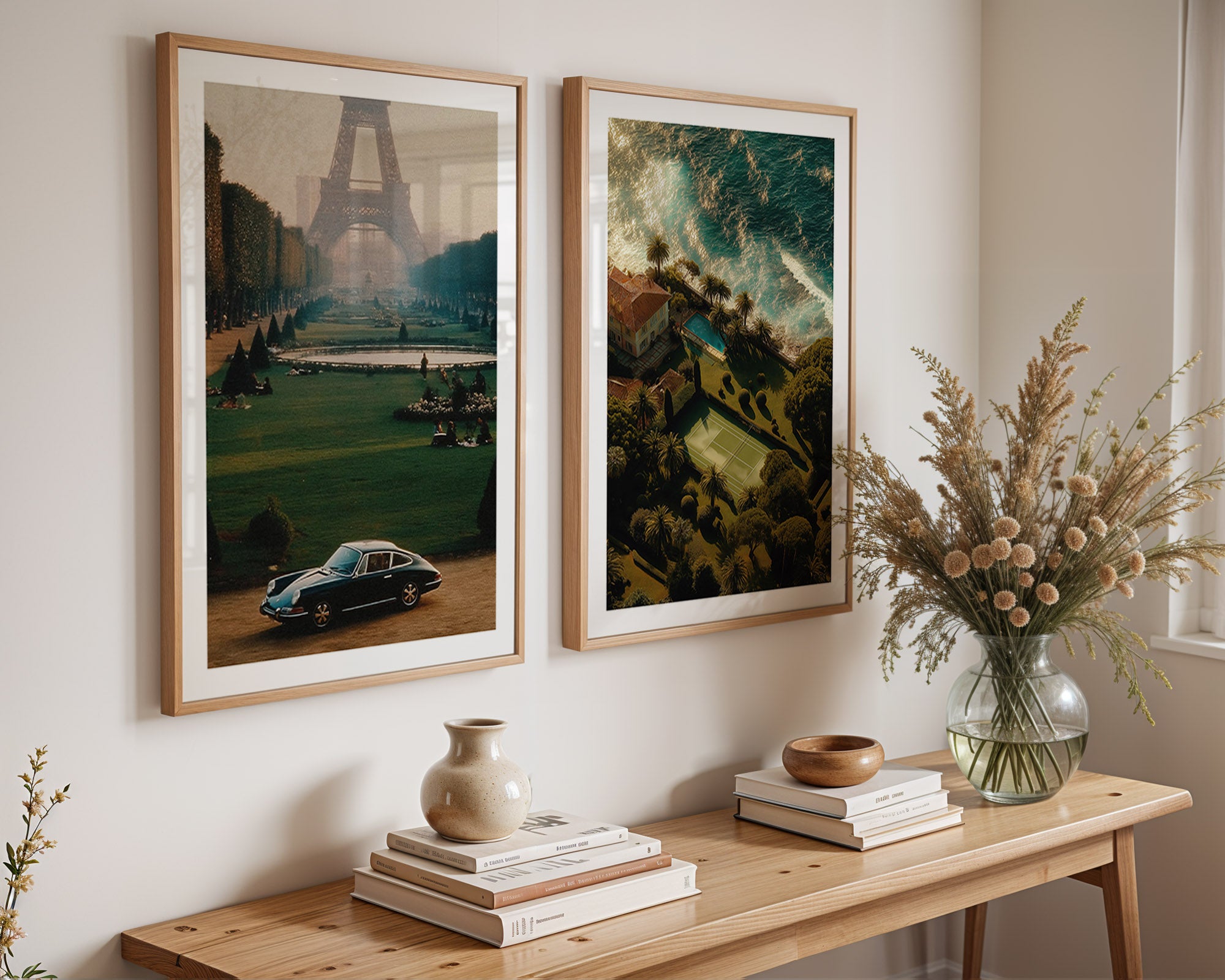 Two framed artworks on a wall above a wooden console table with decorative items.