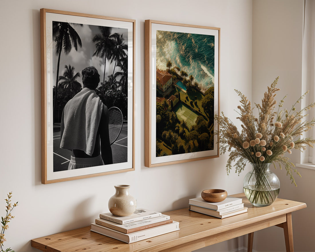 Two framed artworks on a wall above a wooden console table with decorative items.