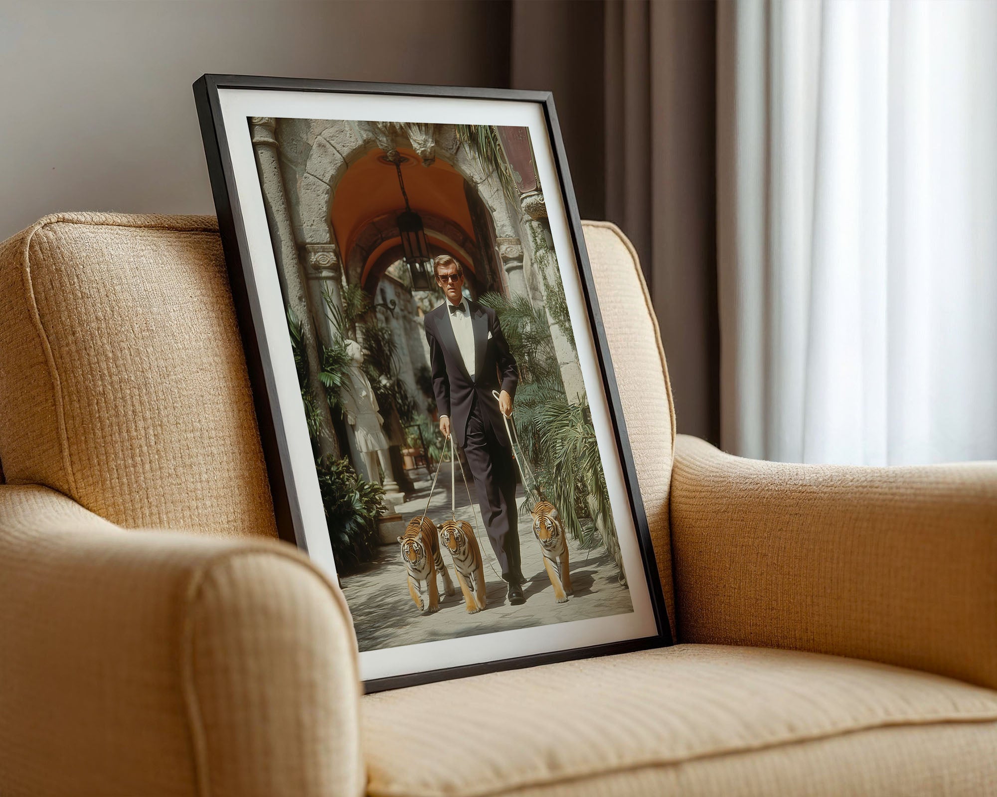 Framed picture of a man with two cubs on a beige armchair