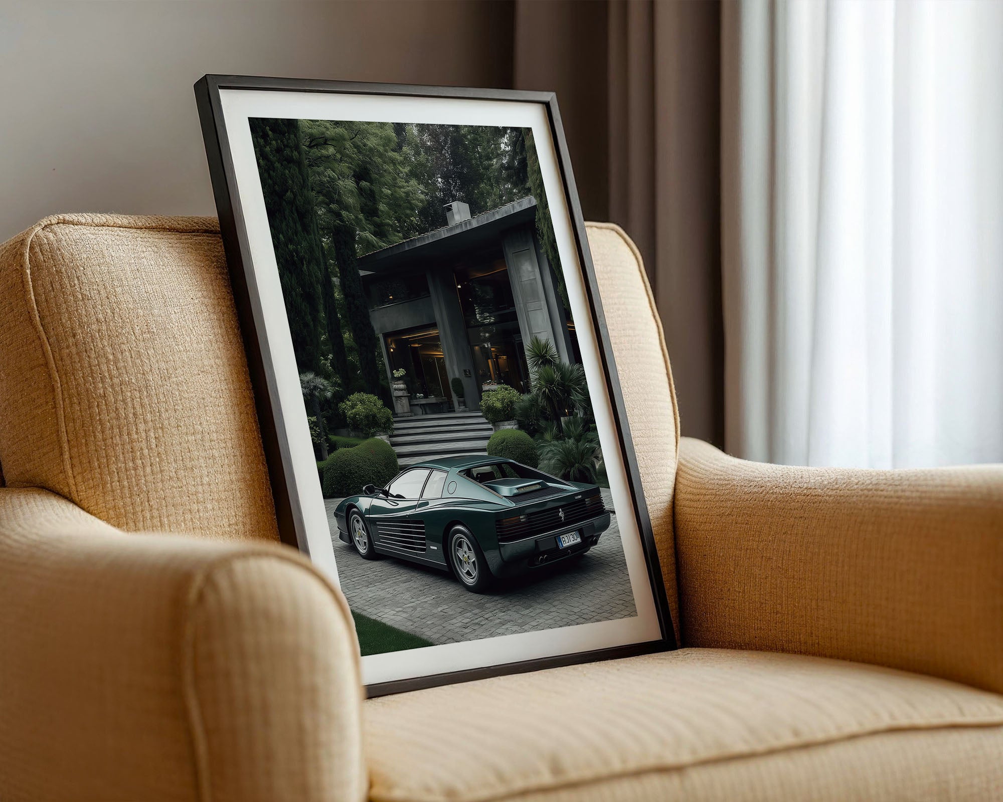Framed photograph of a green Ferrari Testarossa on a beige armchair