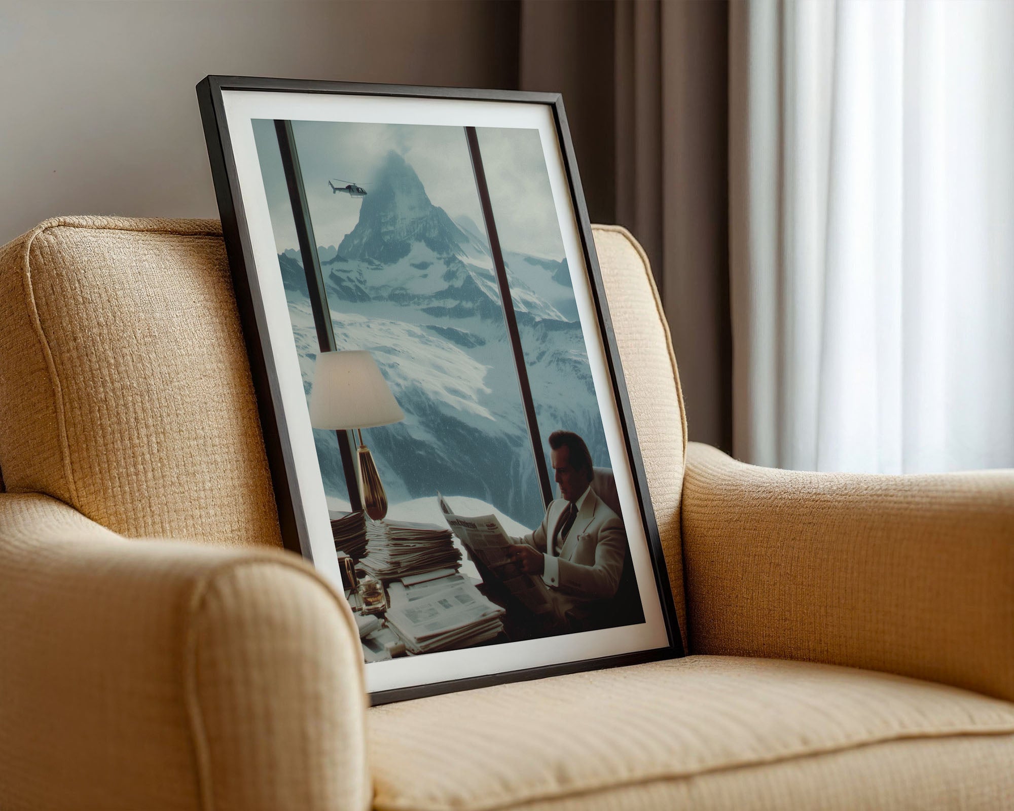 Framed artwork of a mountain scene with a person on a couch