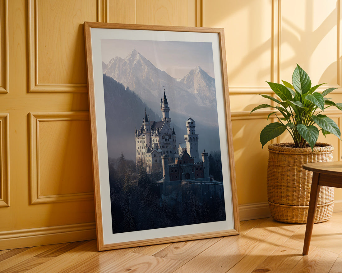 Framed print of a castle with mountains in a room with wooden paneling and a plant.