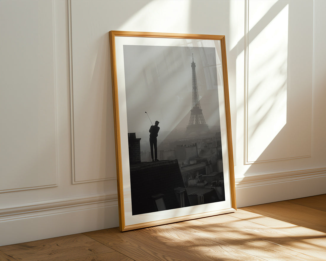 Framed artwork of a silhouette against the Eiffel Tower in a sunlit room.