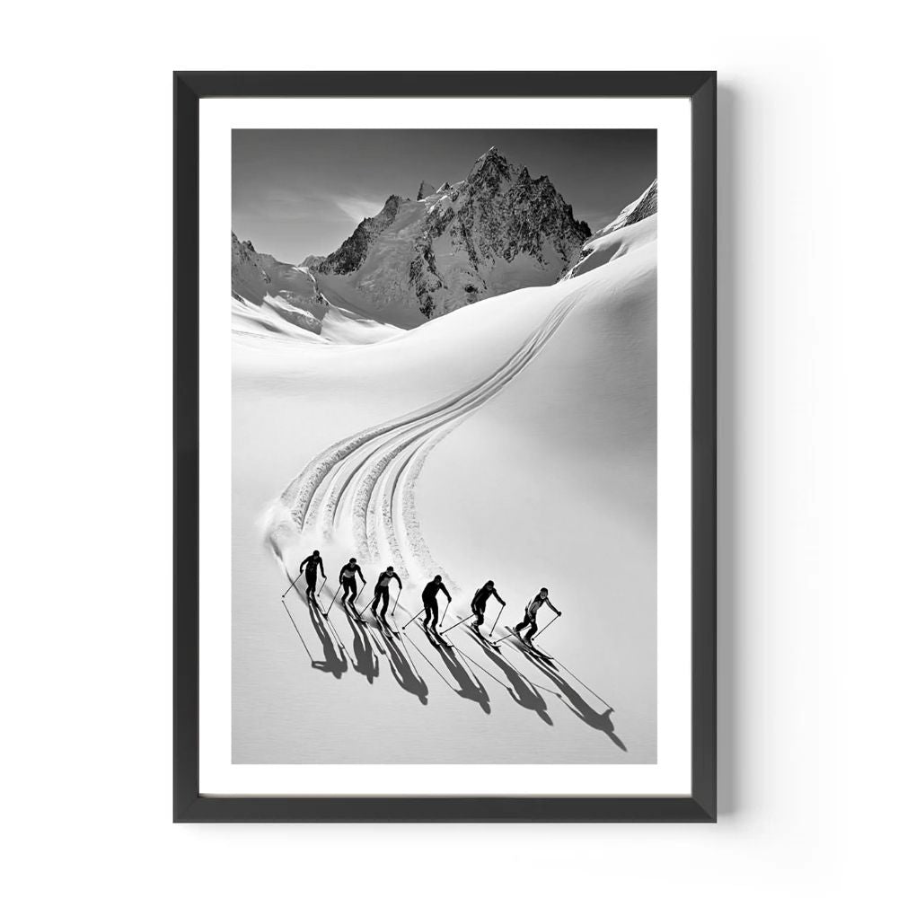 Framed black and white print of skiers on a snowy mountain