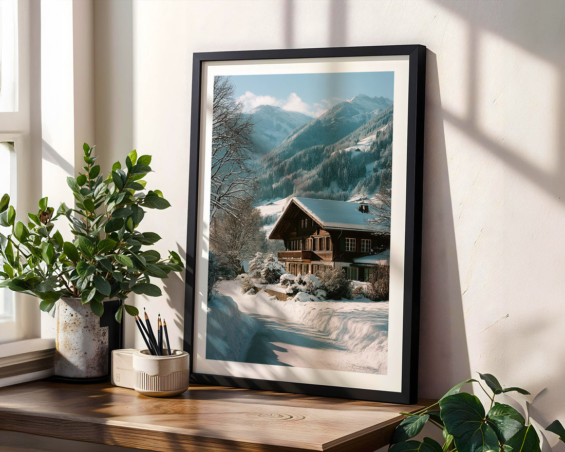 Framed mountain landscape print on a wall with plants and decor below