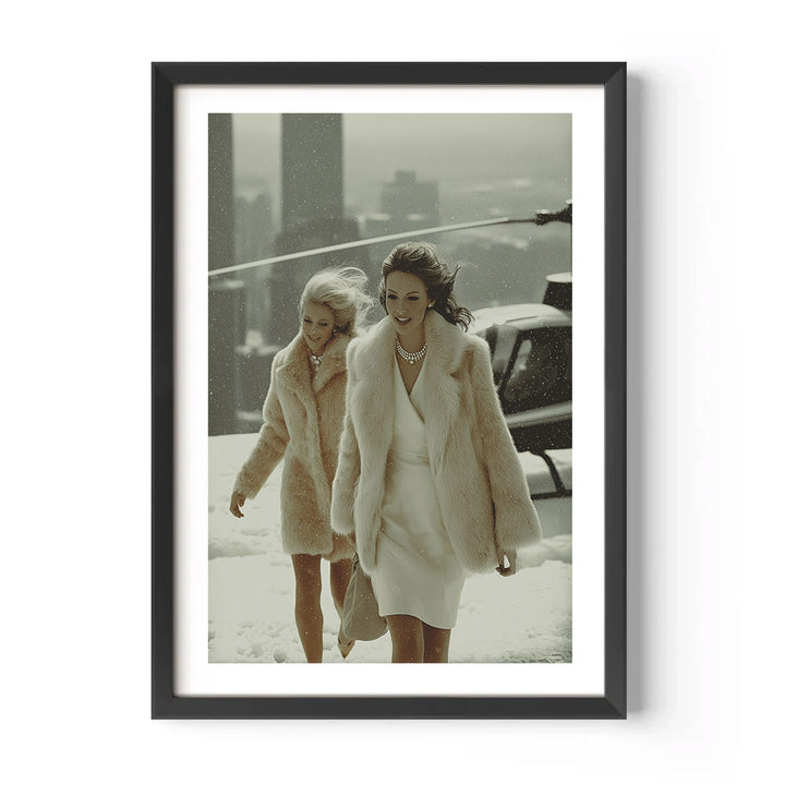Two women in fur coats walking outdoors, framed as a print.