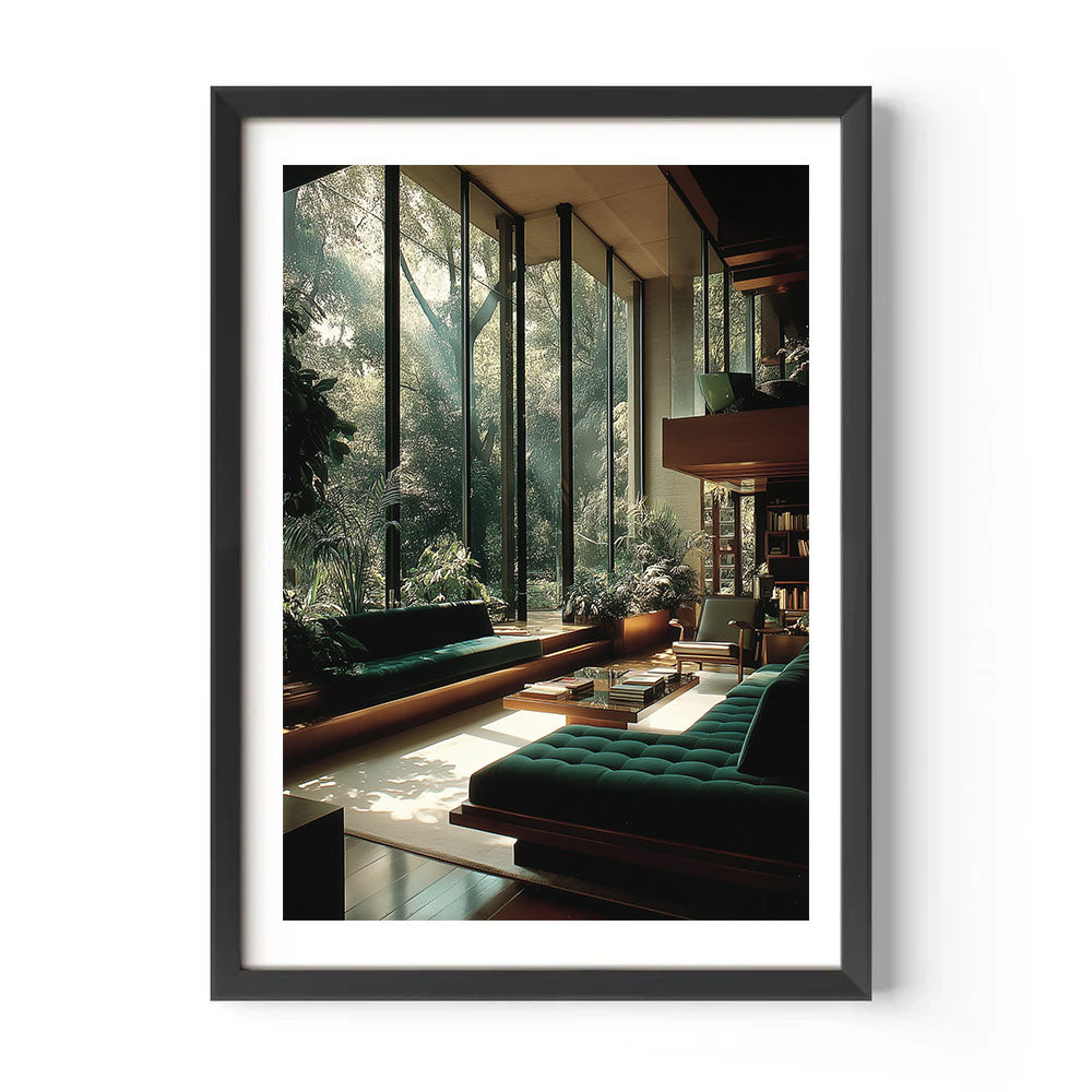 Framed artwork of a modern living room with green sofas and large windows overlooking trees.
