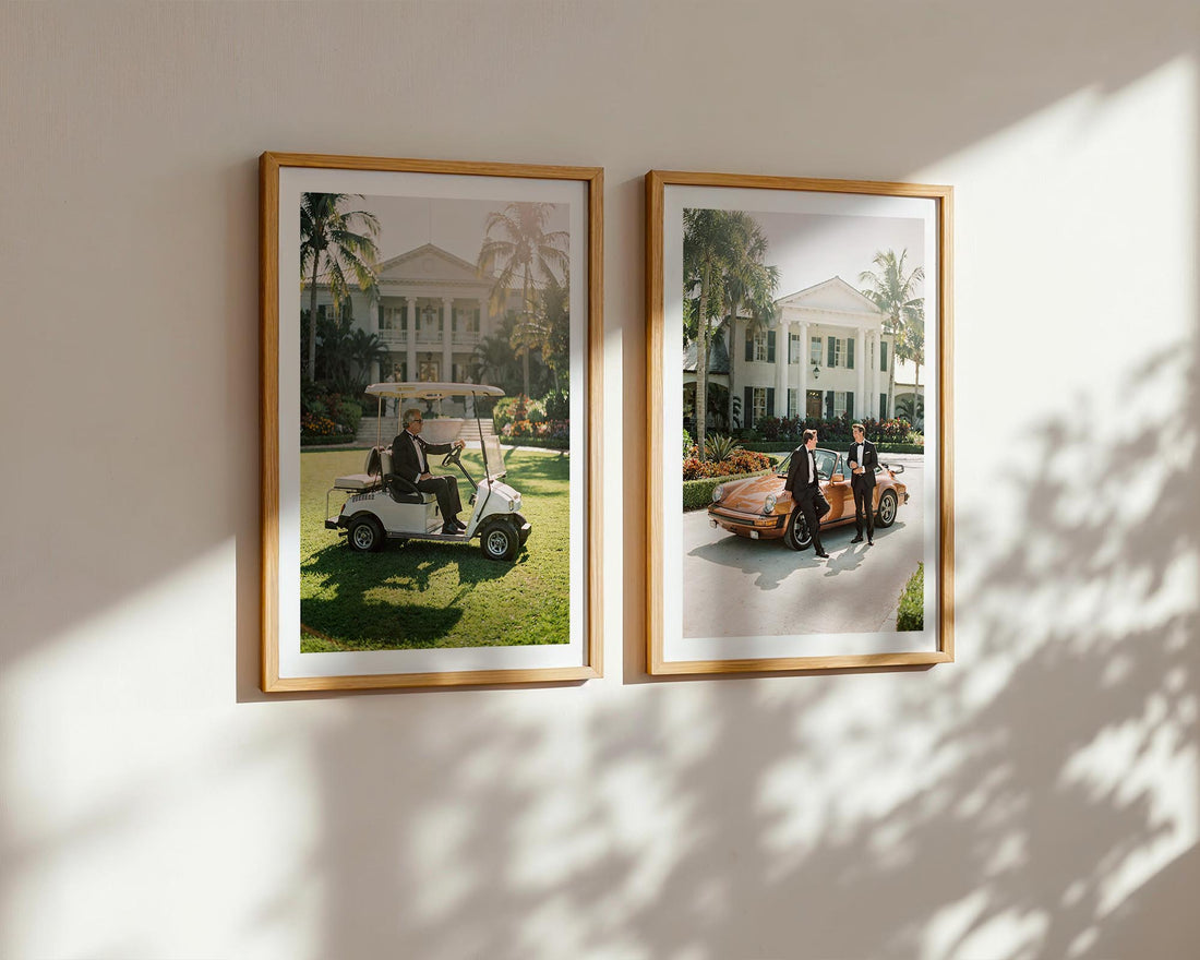 Two framed photographs of people in golf carts on a wall with sunlight casting shadows.