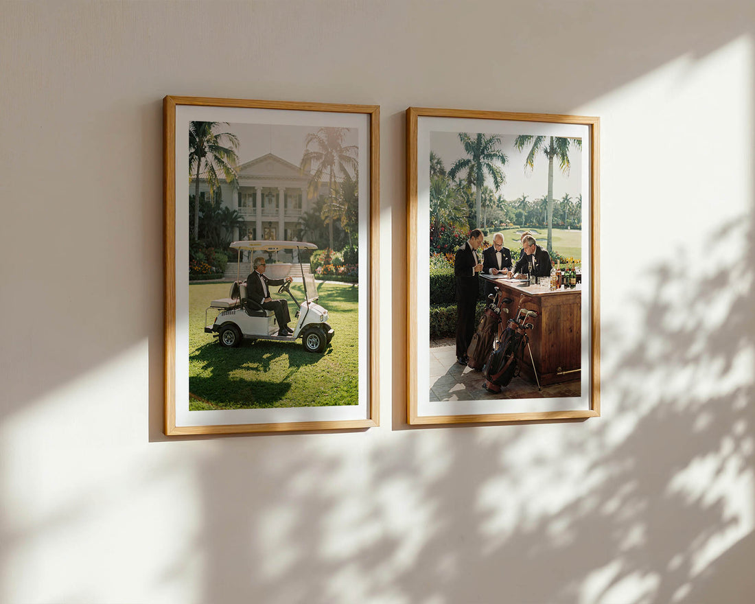 Two framed photographs on a wall with a man in a golf cart and another with people at a table.