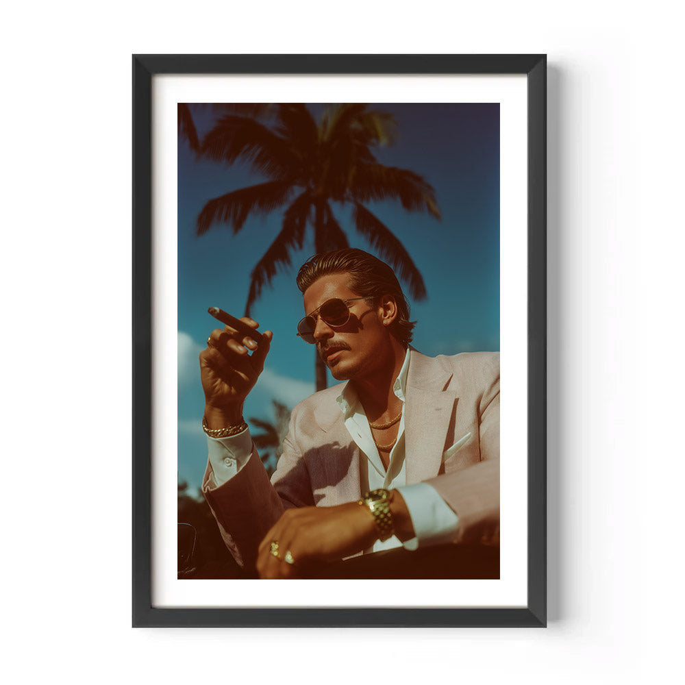 Framed artwork of a man smoking a cigar with palm trees in the background
