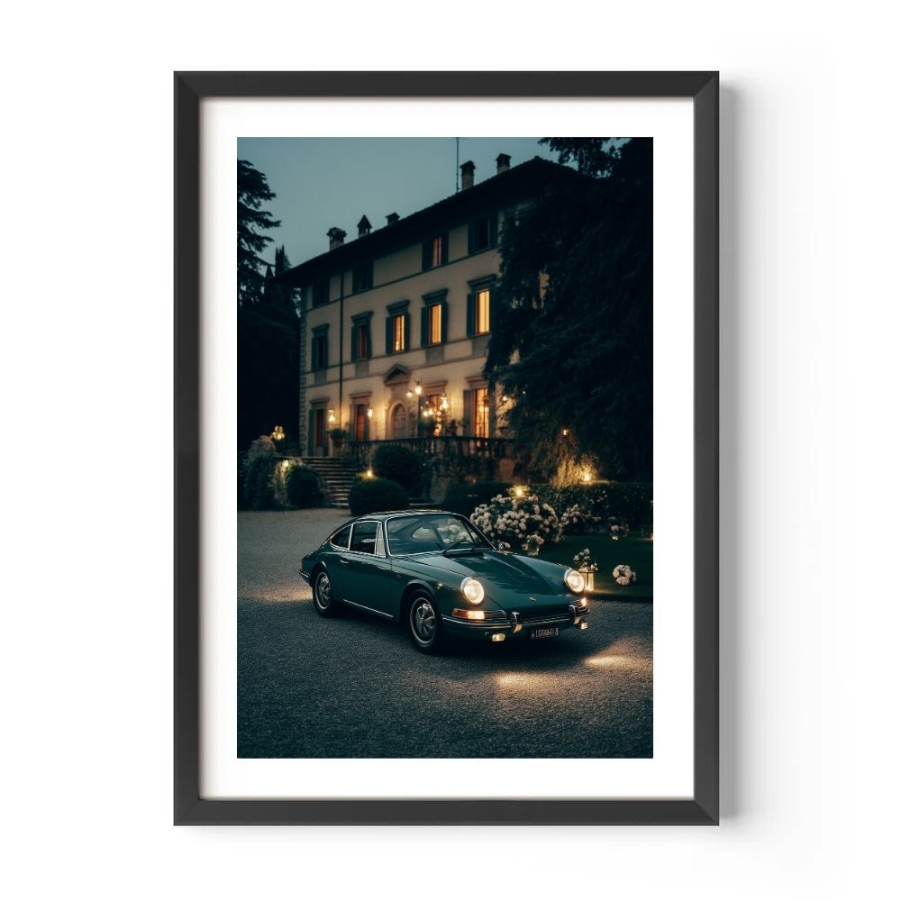 Vintage car parked in front of a large house at night