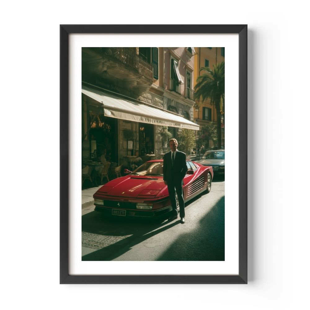 Man standing next to a red sports car on a city street, framed picture.