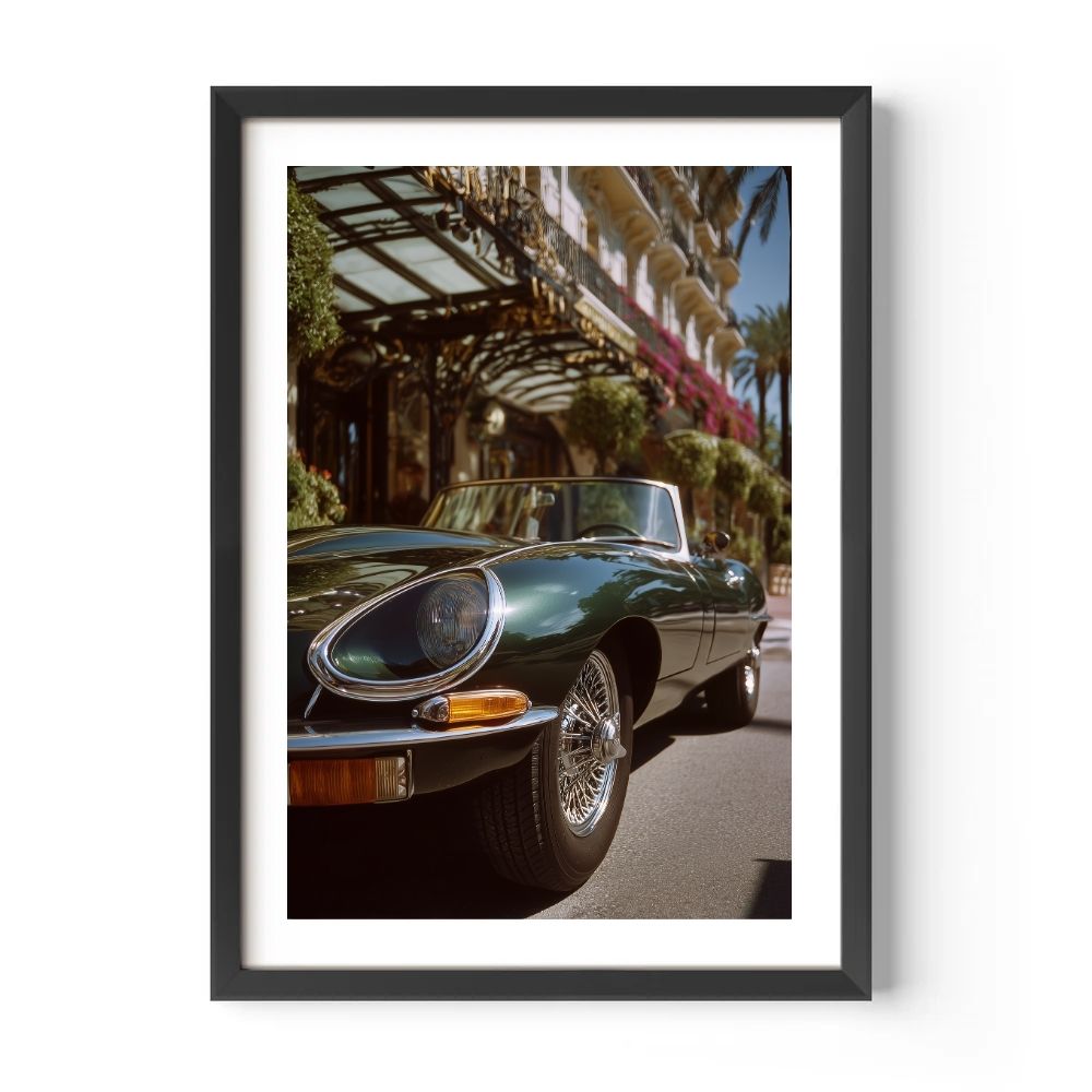 Framed photograph of a classic green Jaguar e-type on a city street