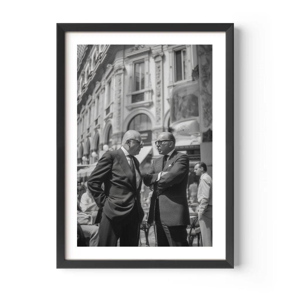 Framed black and white photo of two men in suits on a city street.