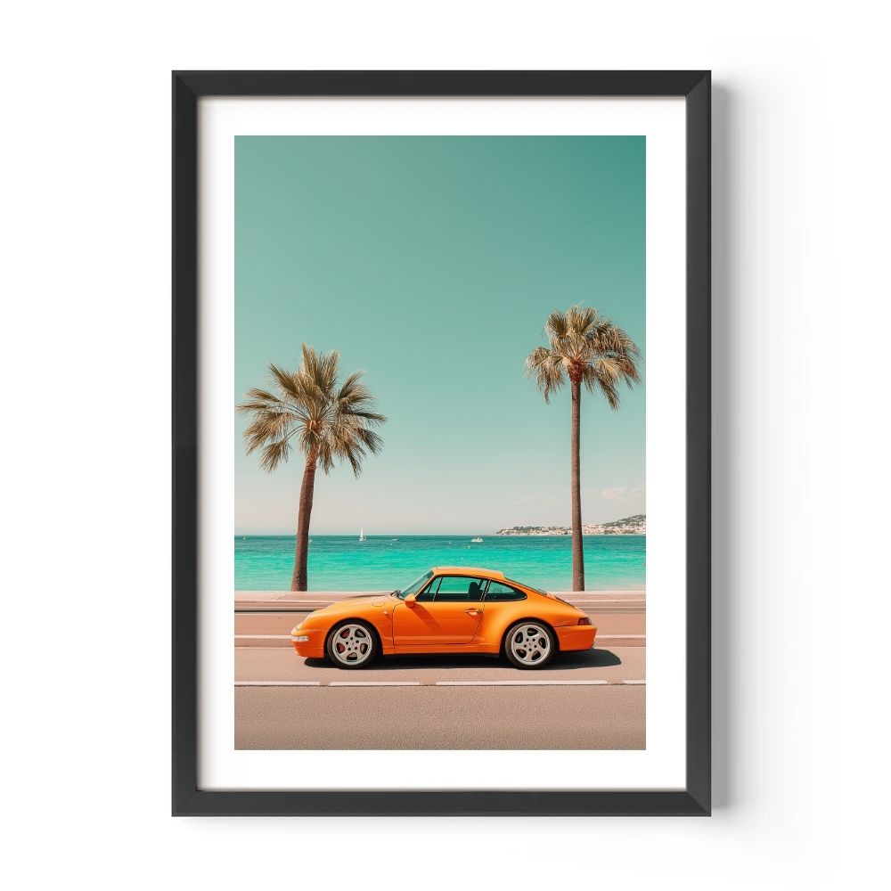 Framed artwork of an orange sports car on a beach with palm trees and blue sky.