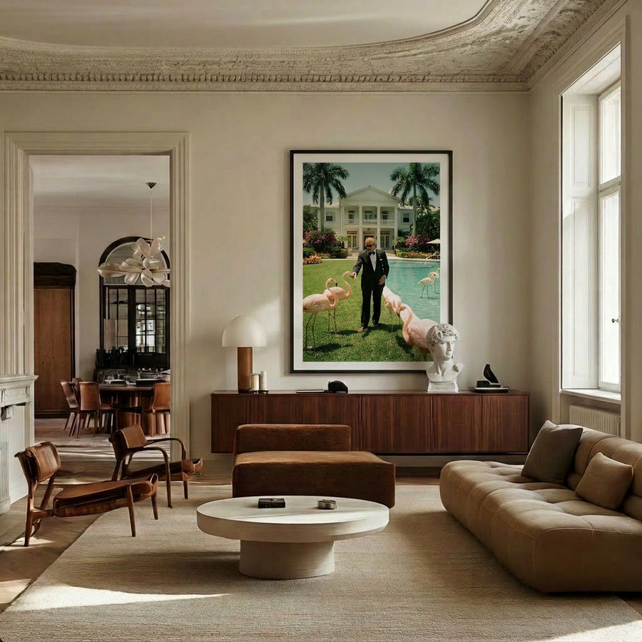 Luxurious living room with modern furniture and a large painting of a pool scene.