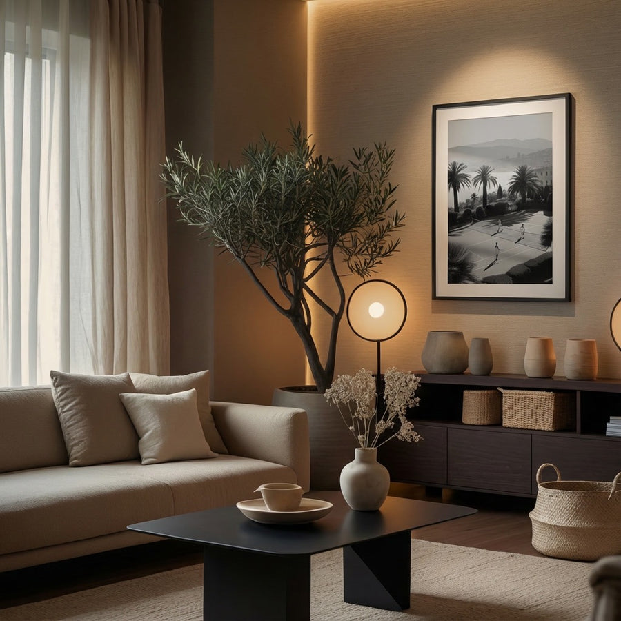 Modern living room with a couch, coffee table, and decorative items.