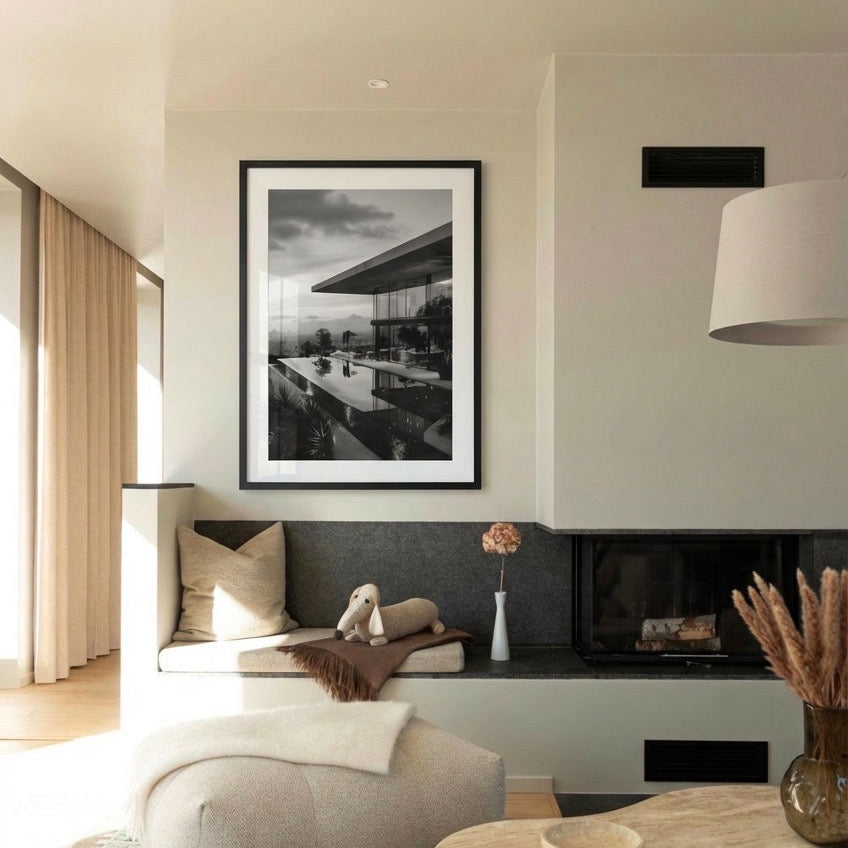 Modern living room with a framed black and white photo, sofa, and decorative elements.