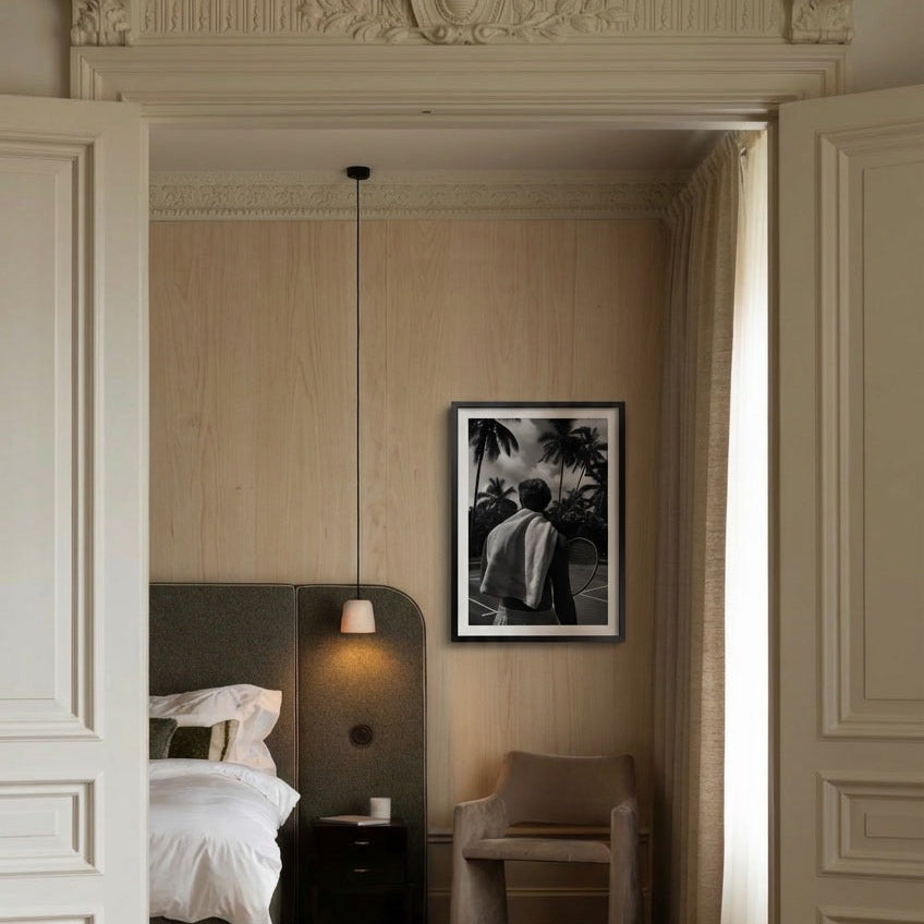 Modern bedroom with a framed artwork on the wall