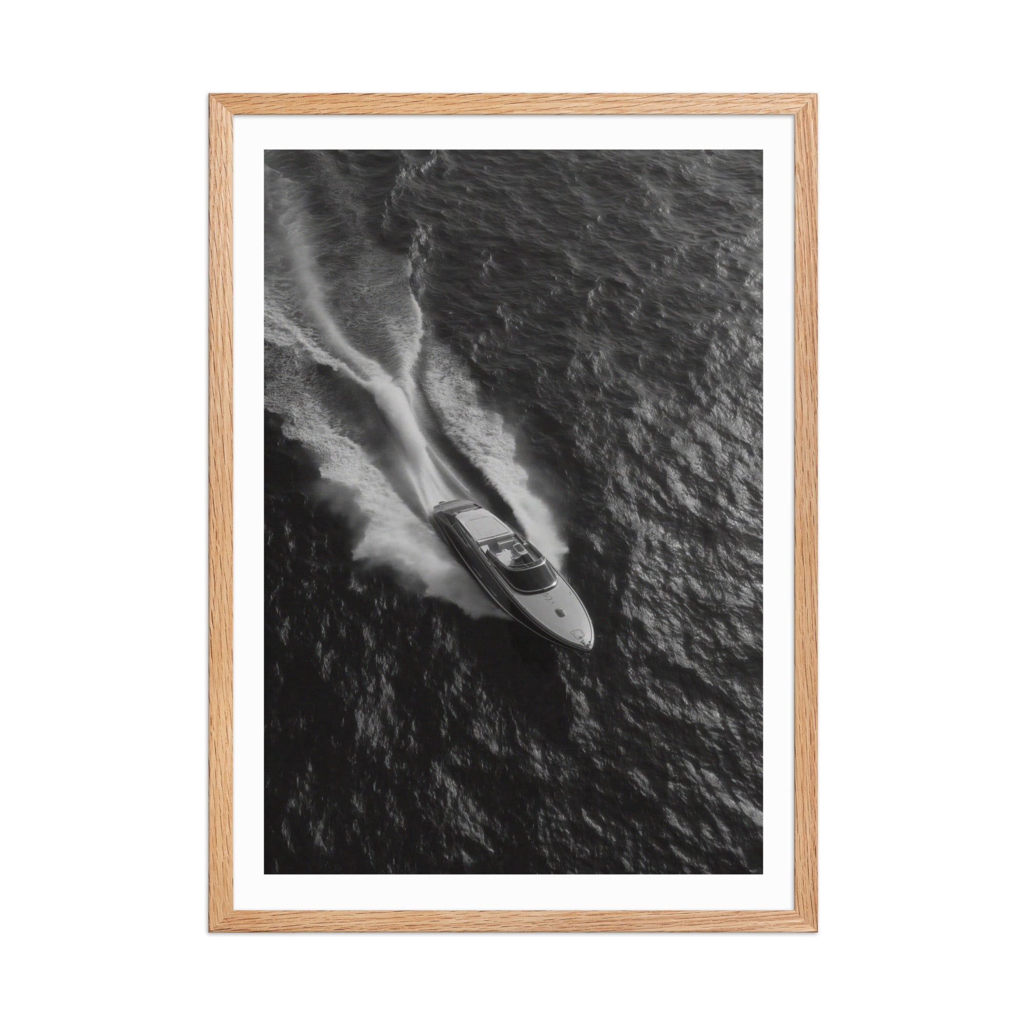 Framed black and white photograph of a speedboat on water
