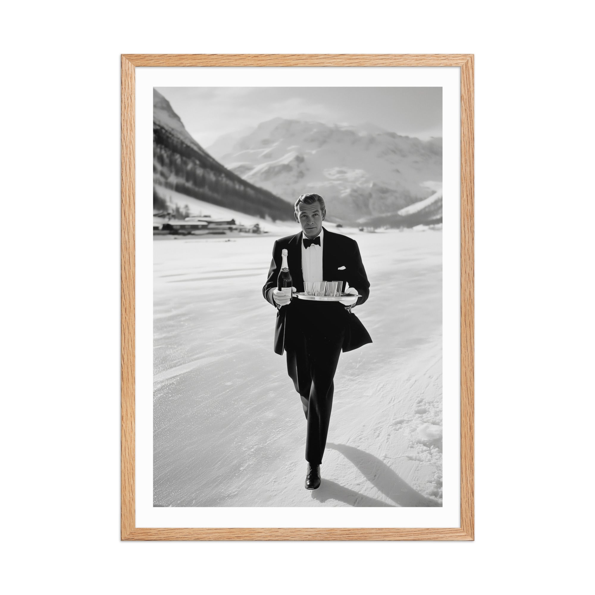 Framed black and white photo of a man in a tuxedo walking outdoors with mountains in the background.