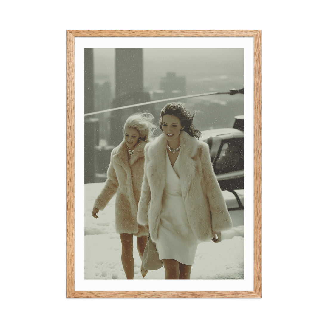 Two women in winter fur coats walking outdoors in the snow, framed with a wooden border.