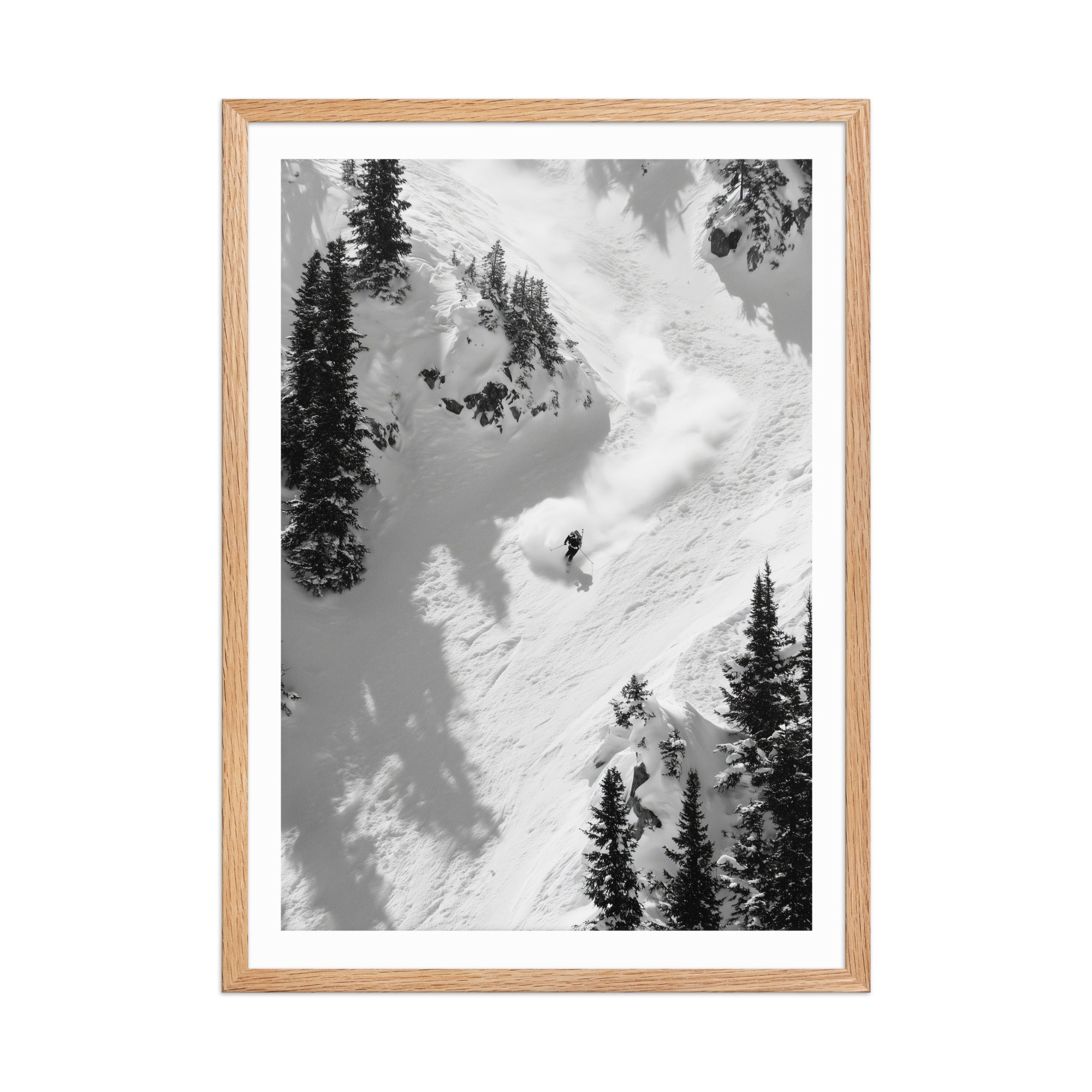 Framed black and white photograph of a skier in a snowy mountain landscape.