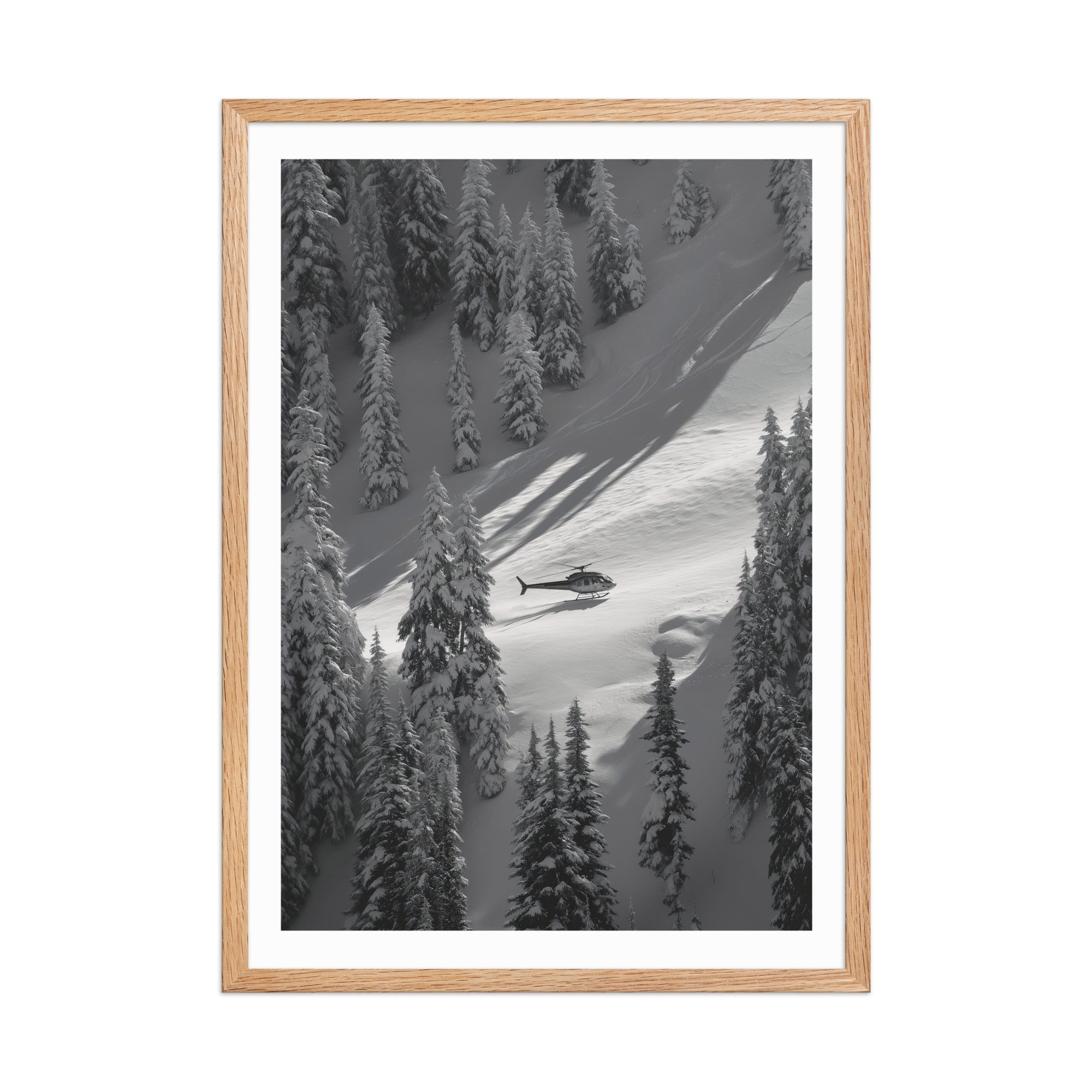 Framed black and white photograph of a helicopter in a snowy forest landscape.