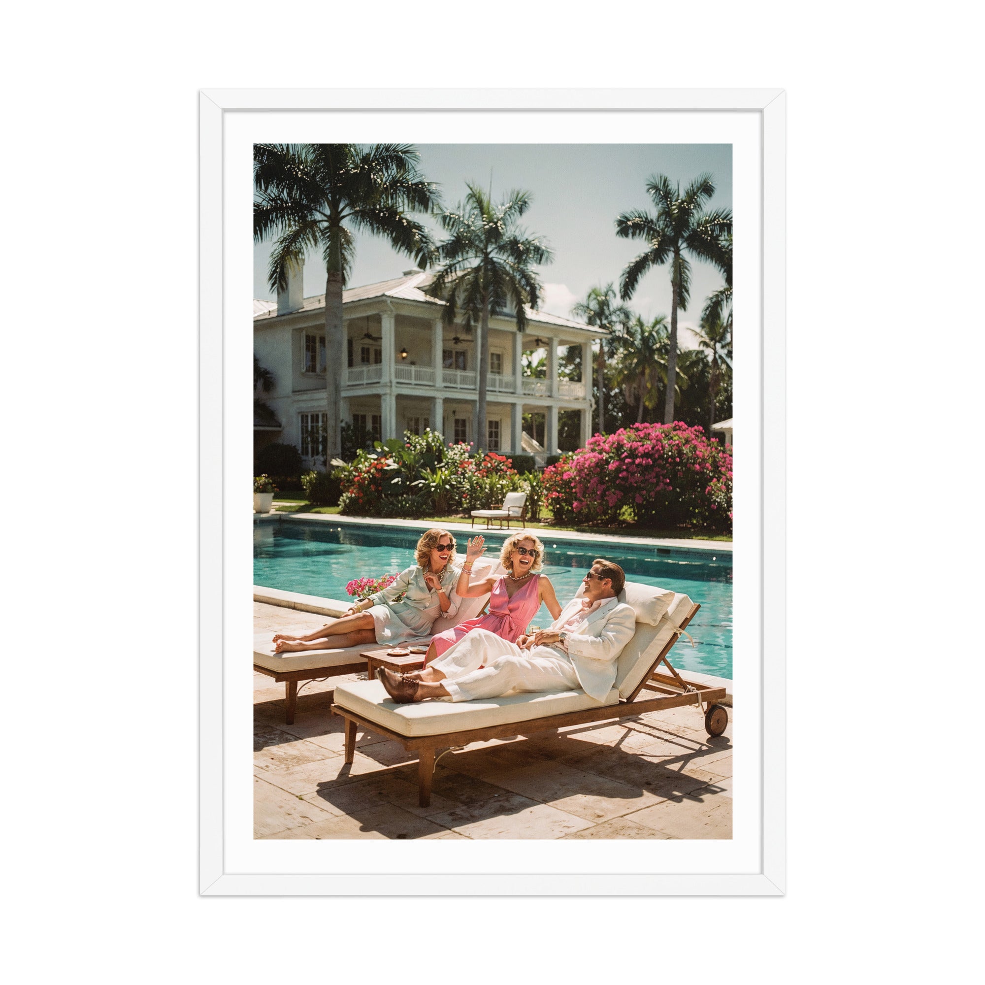 Three people sitting by a pool with palm trees and a large house in the background.