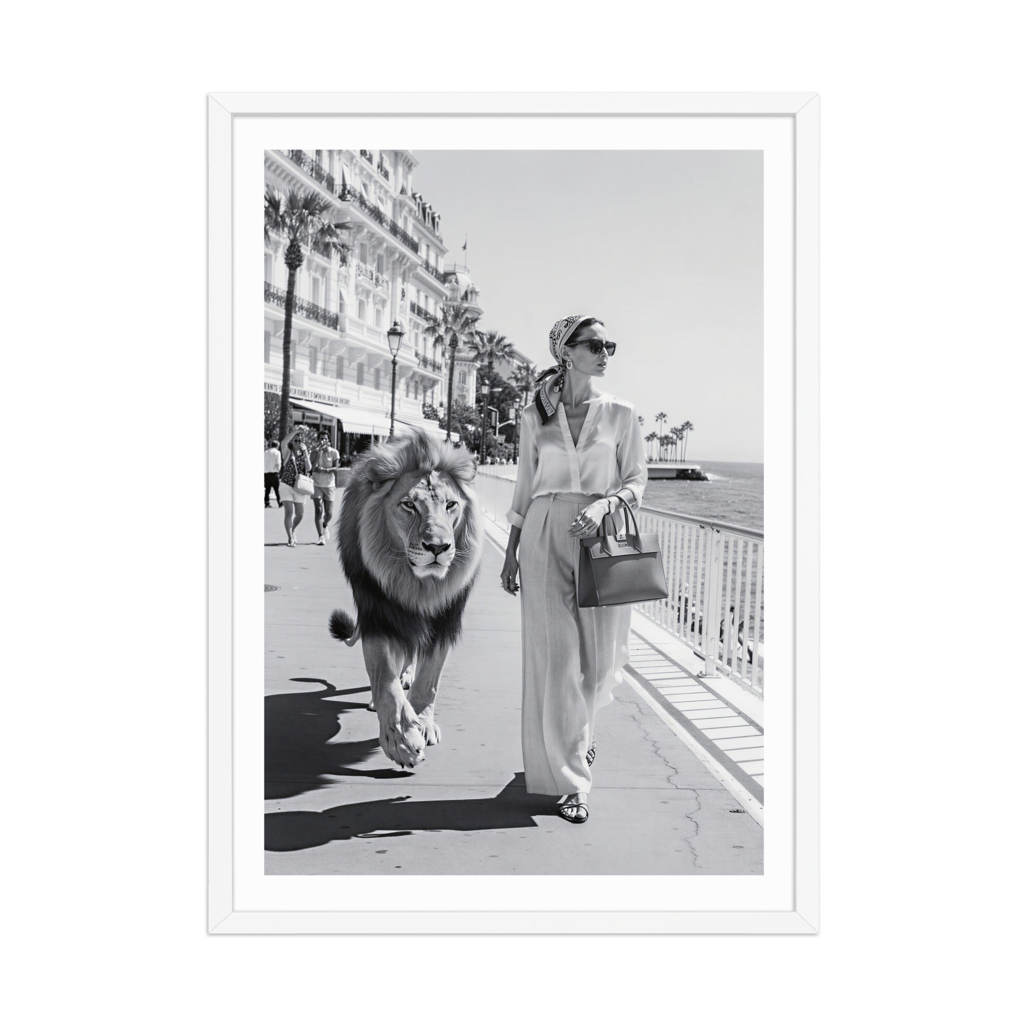Woman walking a lion on a city street with palm trees and buildings in the background.