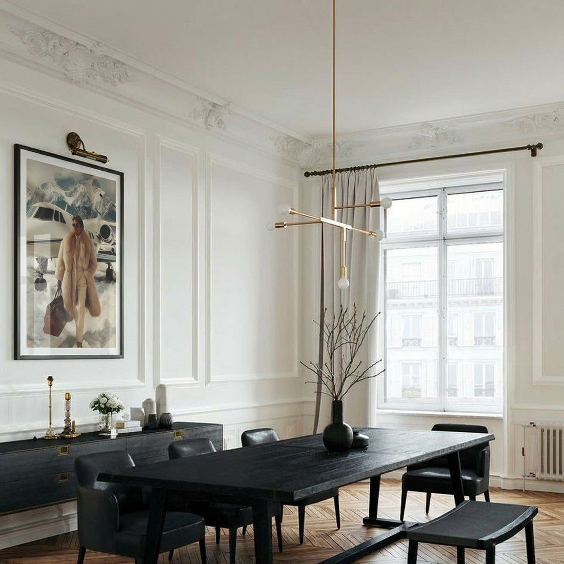 Modern dining room with a black table and chairs, white walls, and large windows.