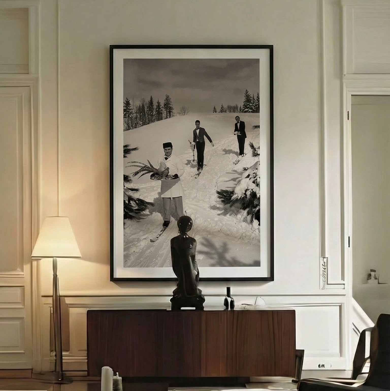 Modern living room with a large black and white framed picture on the wall.