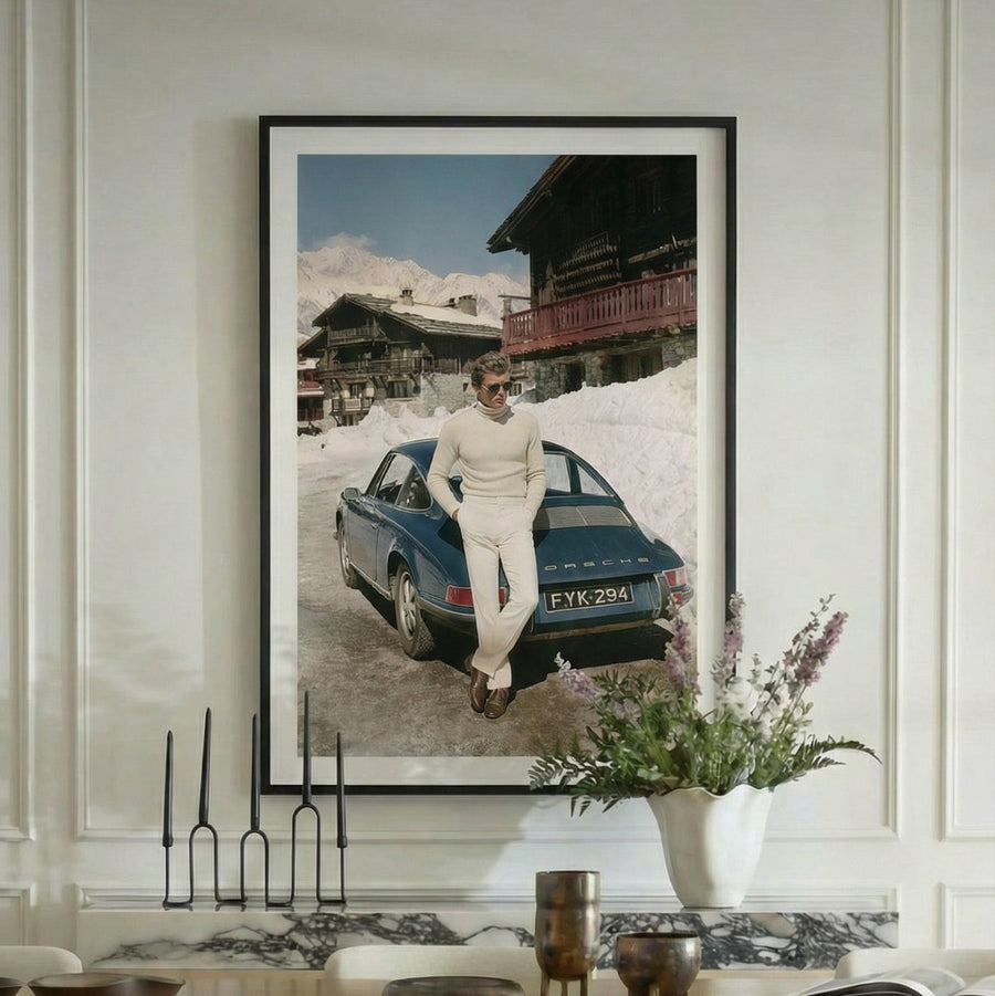 Dining room with a large framed photograph on the wall, featuring a person by a car.