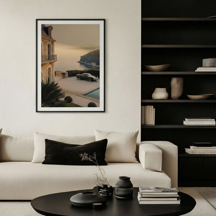 Modern living room with a sofa, coffee table, and framed artwork on the wall.